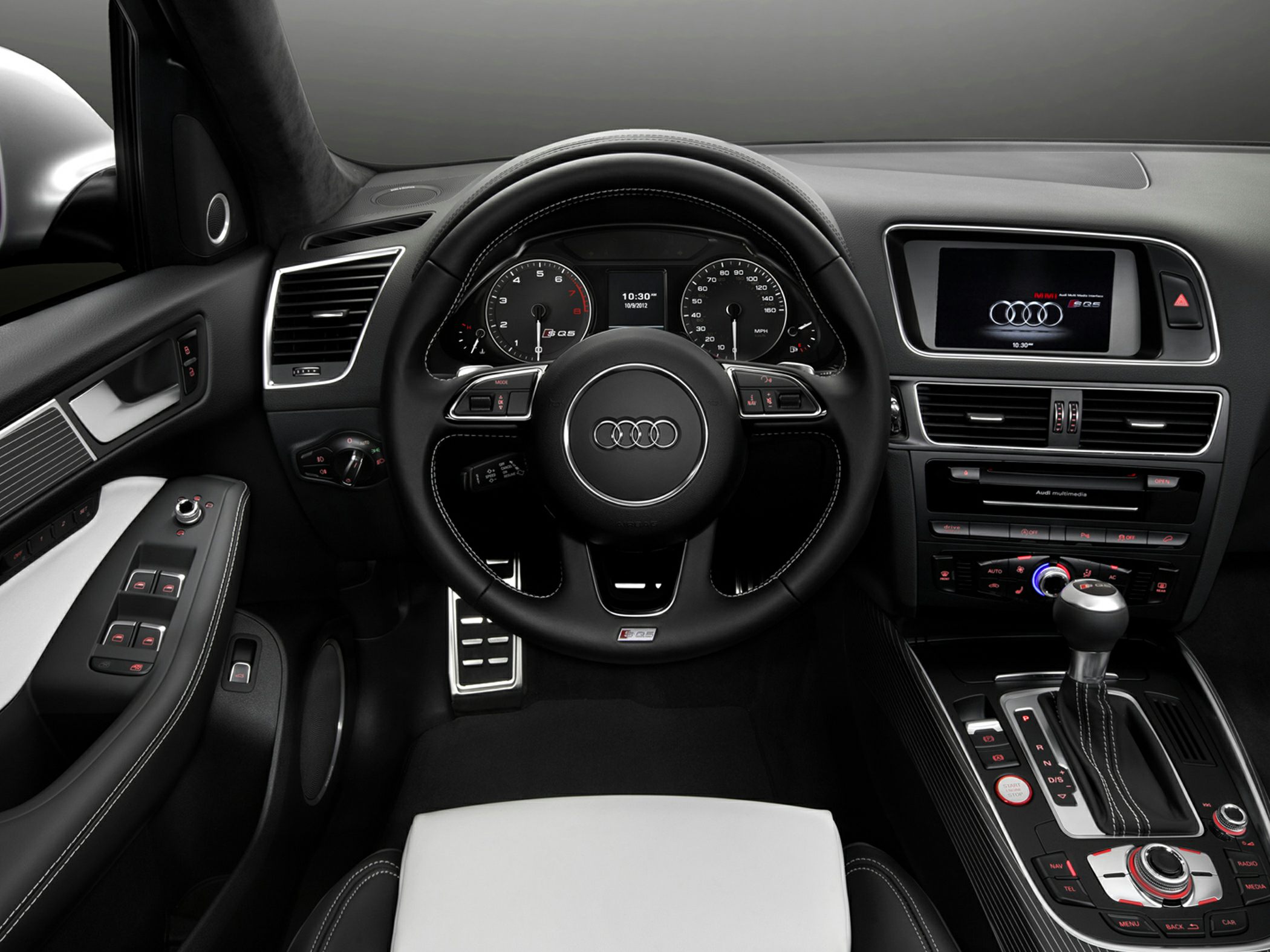 Steering wheel, dashboard, center console with multimedia controls