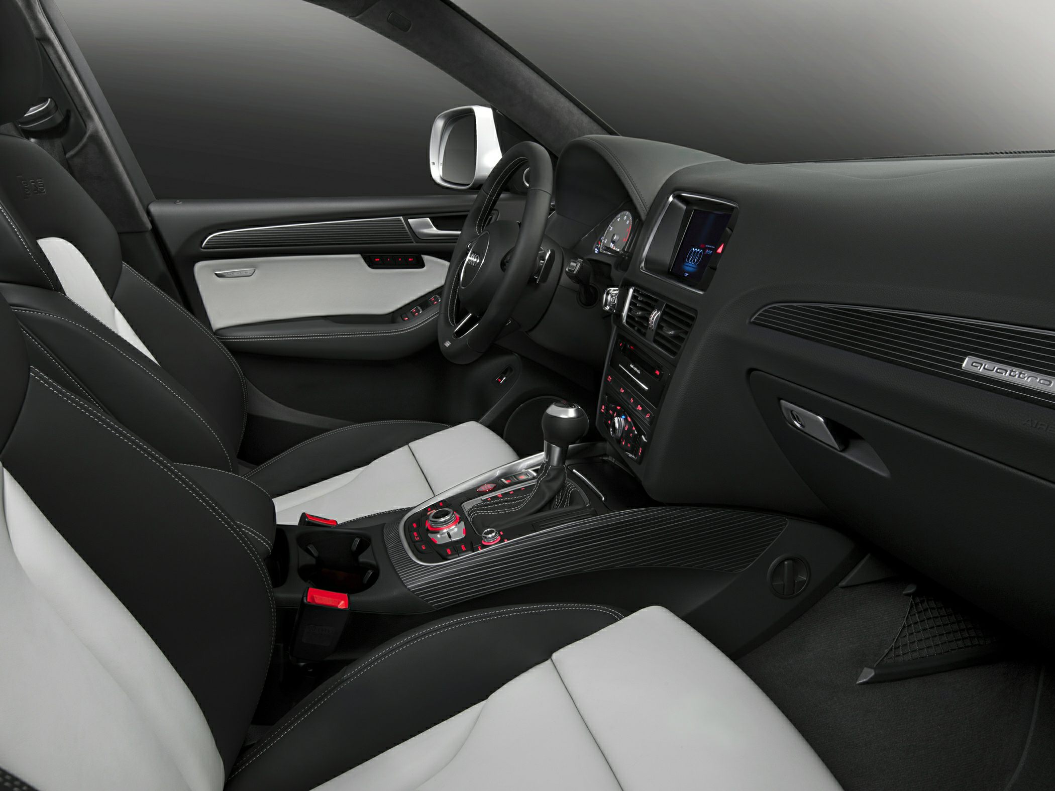 Modern dashboard and dual-tone leather seats with multi-function steering wheel.