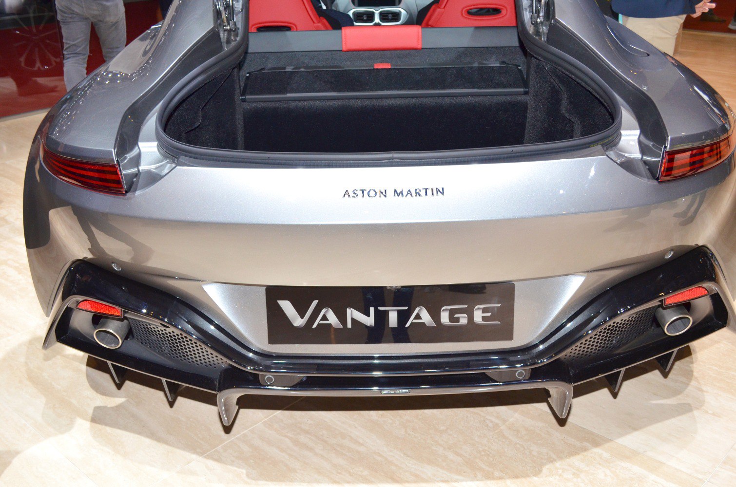 Rear open trunk with visible exhausts and diffuser