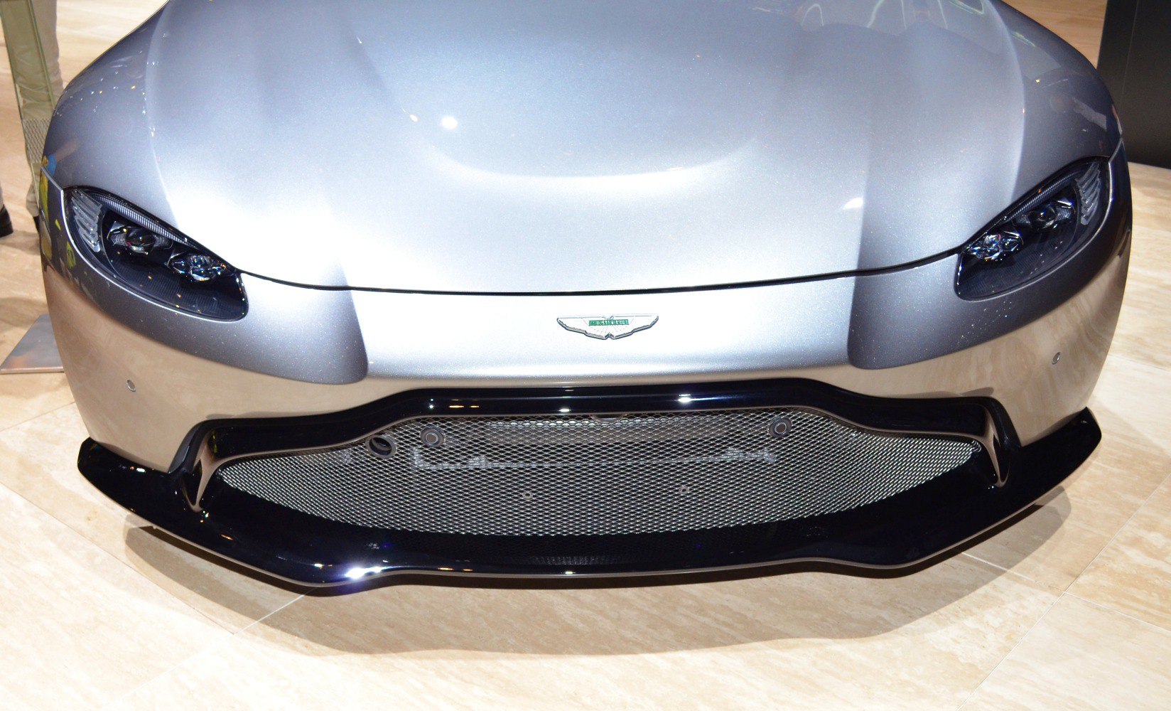 Sleek headlights and large mesh grille front end.
