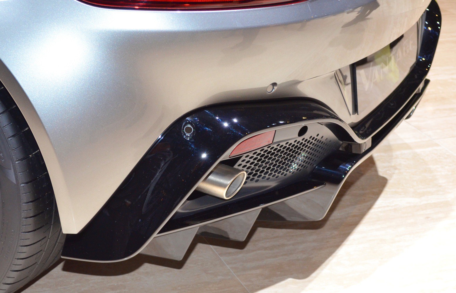 Sporty rear bumper diffuser and single exhaust pipe