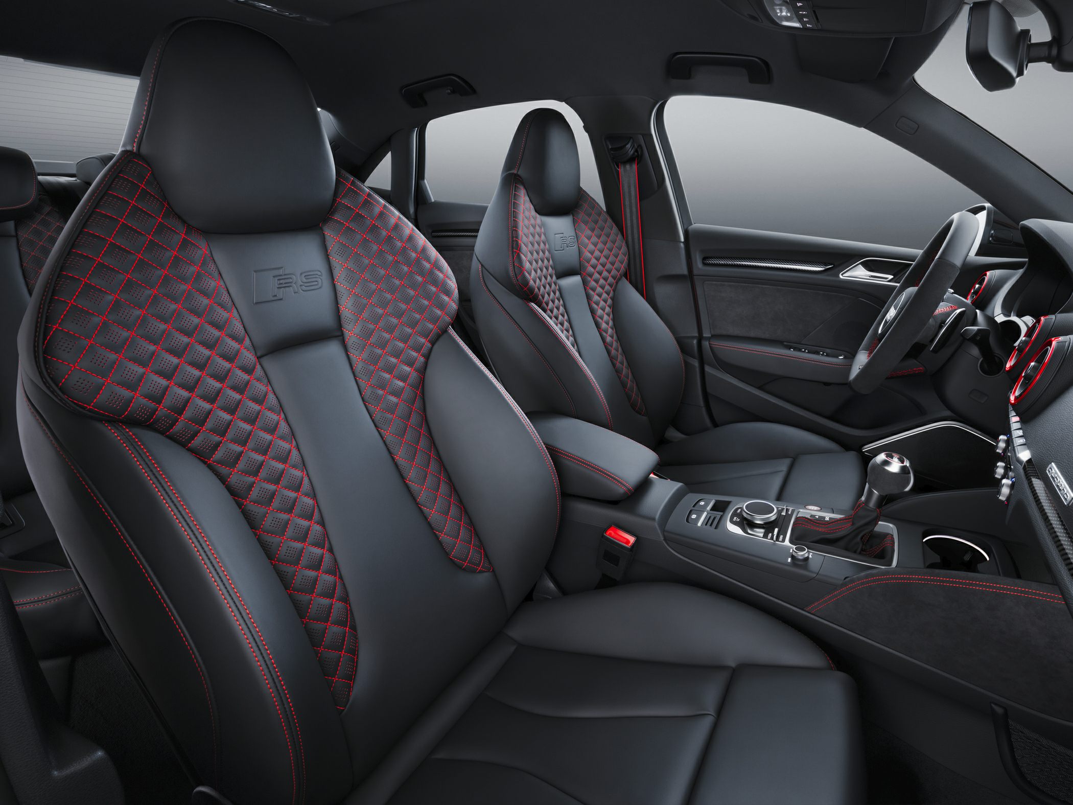Sport seats with red stitching and center console with manual gearshift