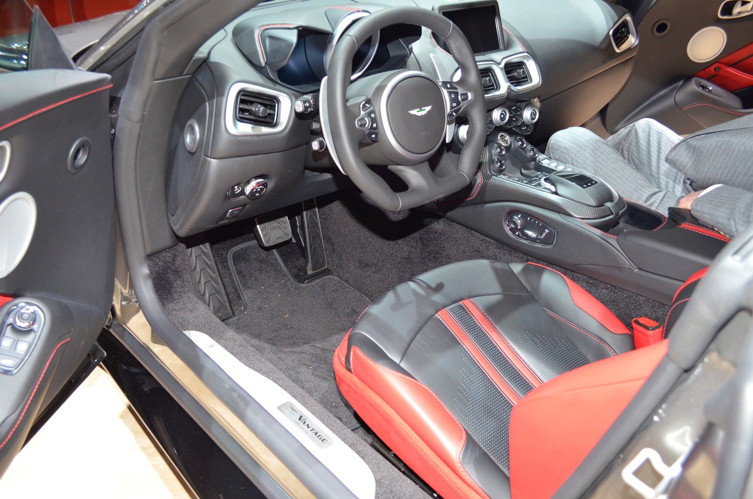 Sporty black and red leather seats with advanced dashboard and carbon fiber console
