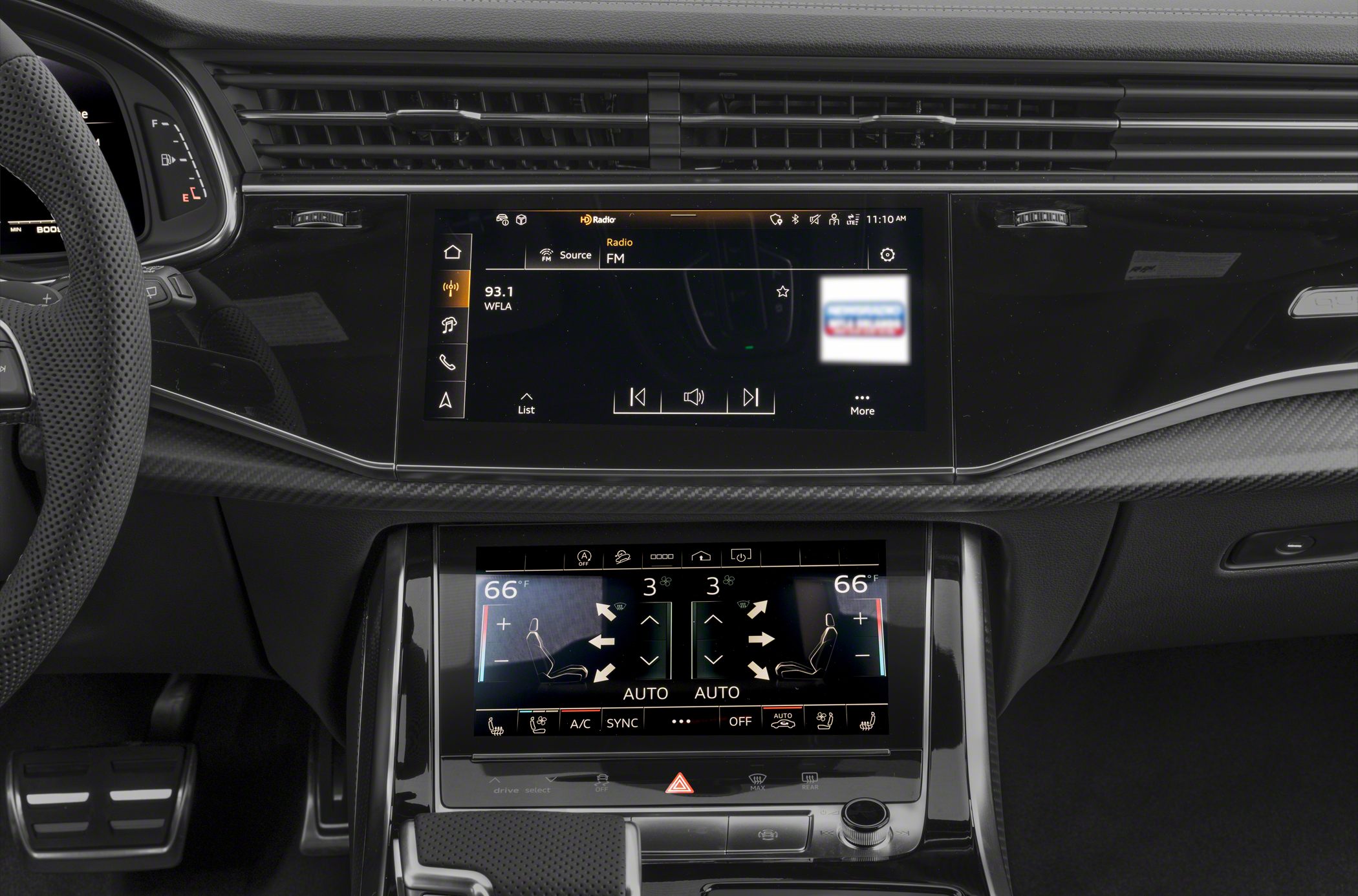 Dual touchscreen infotainment and climate control in a modern luxury SUV interior