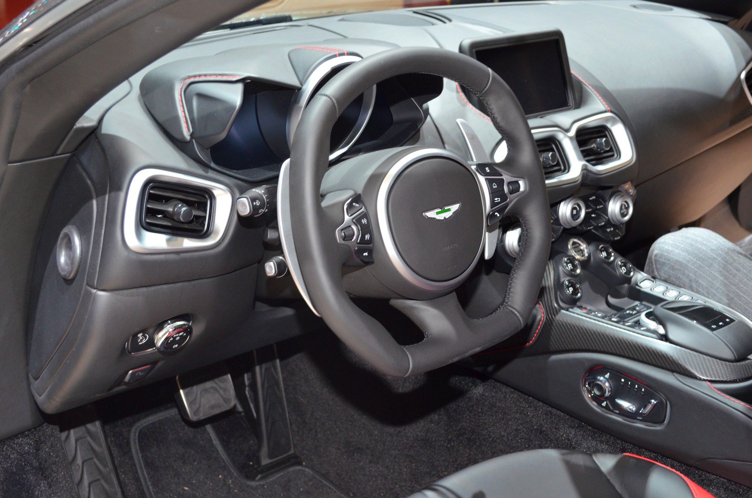 Luxury car interior with detailed steering wheel and dashboard design