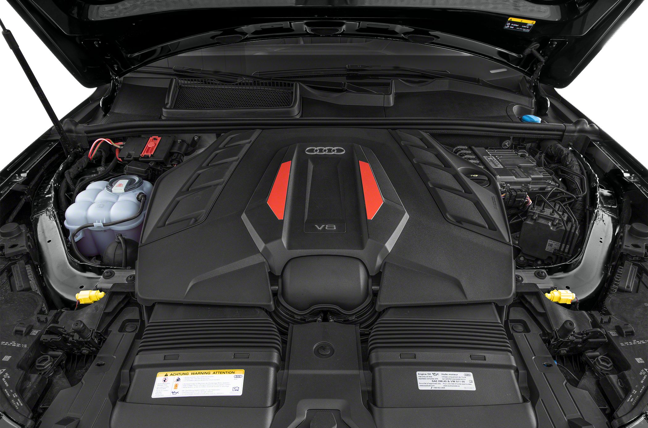 Close-up of performance V8 engine cover with Audi rings and red accents.