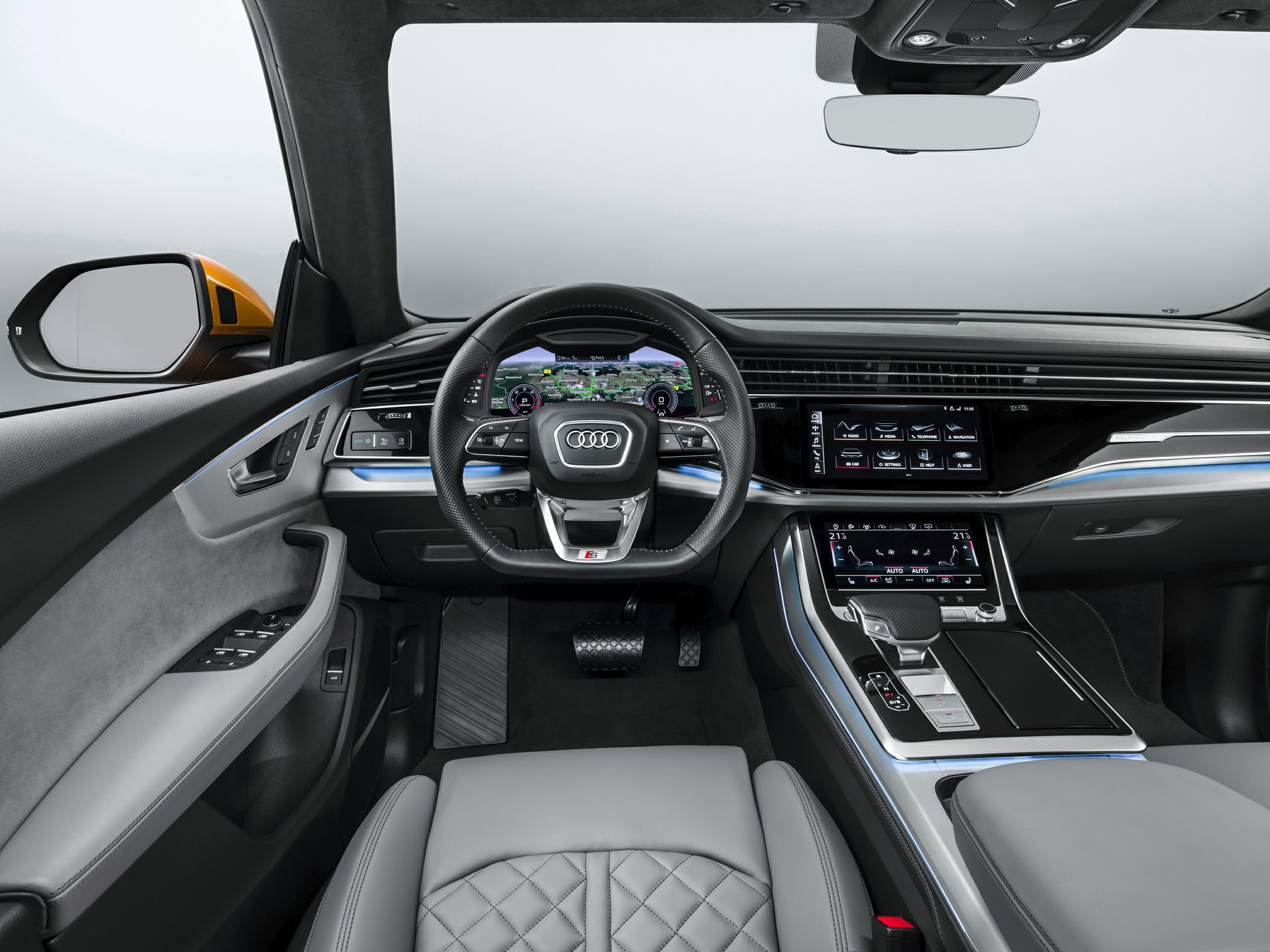 Digital dashboard, dual touchscreen center console, luxury quilted seat
