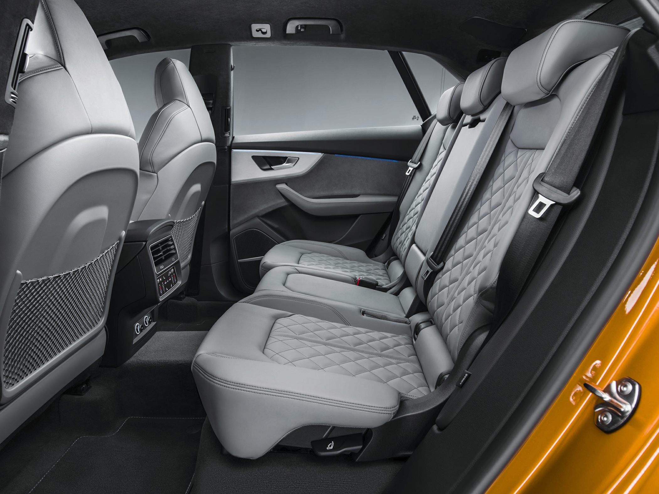 Rear passenger seats with quilted leather upholstery and modern design