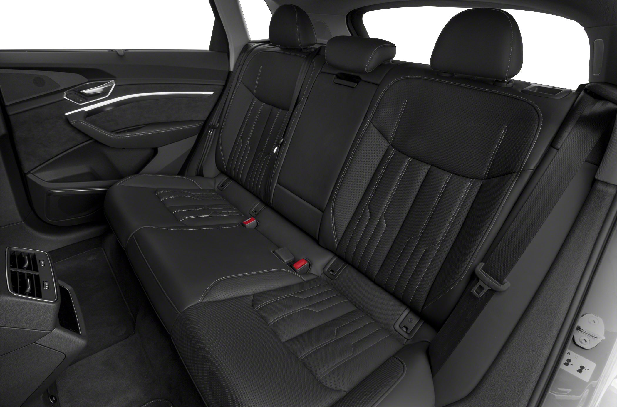 Rear passenger seats with black leather upholstery and detailed stitching