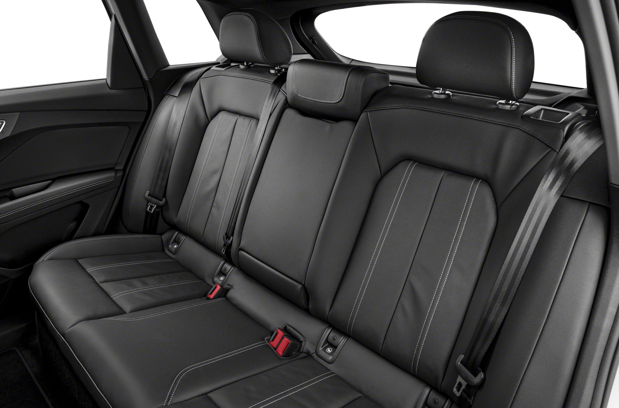 Rear black leather seats with stitching and seat belts in modern SUV interior