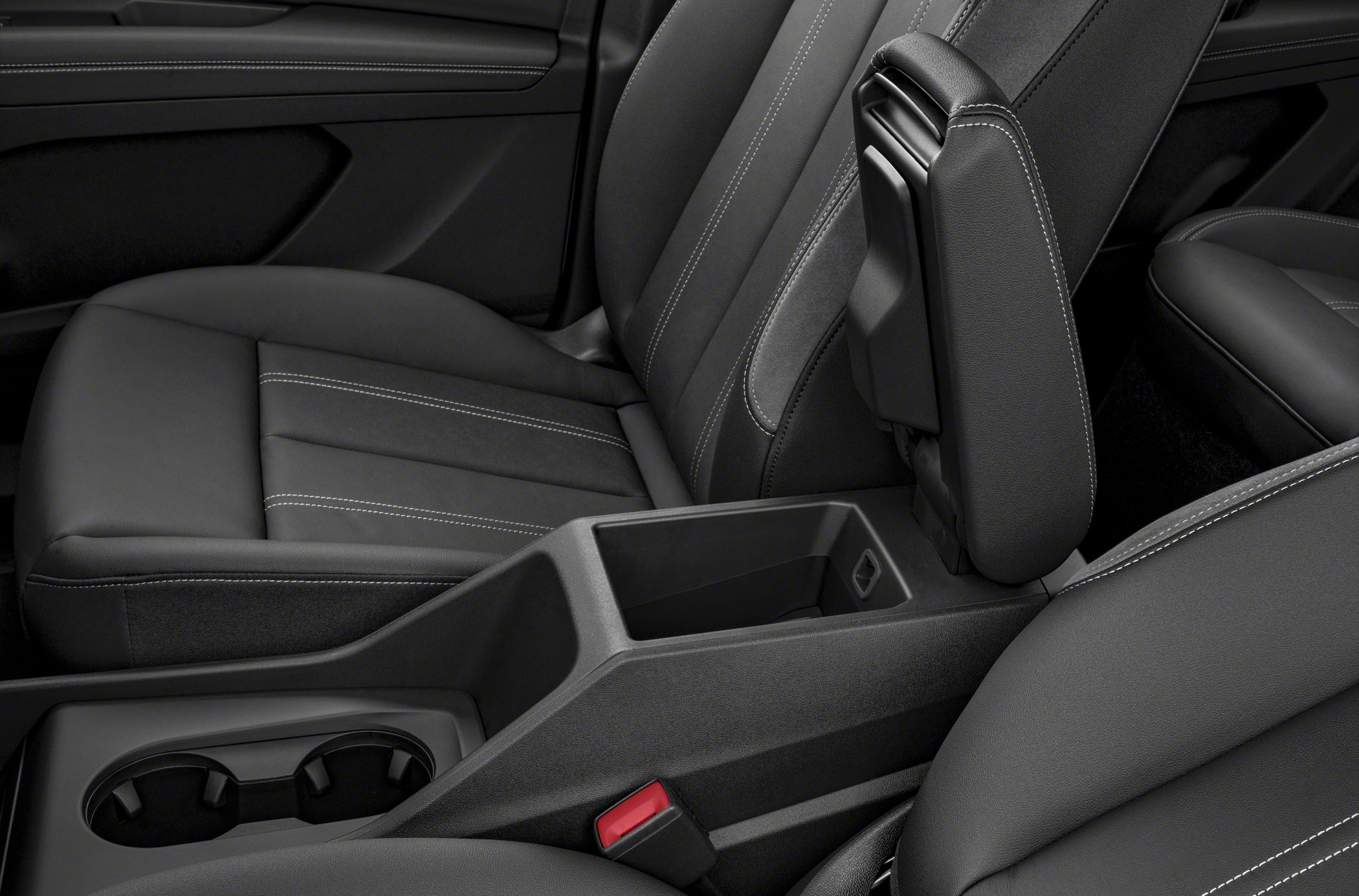 Black stitched car seats and center console with cup holders and storage compartment