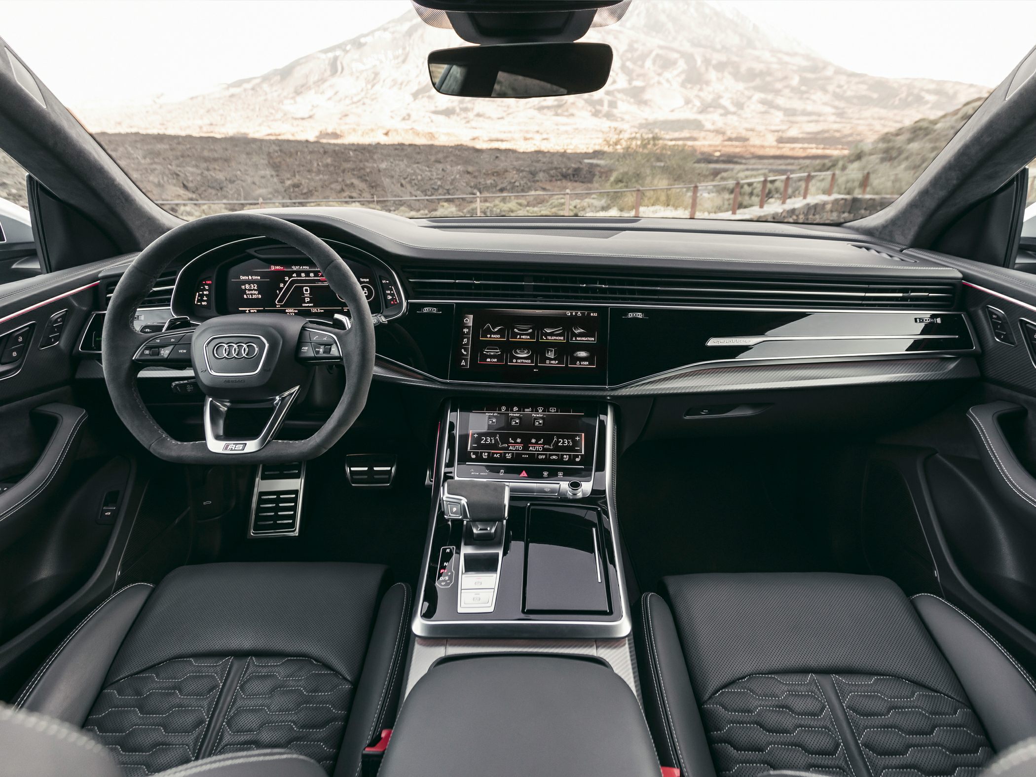 Digital instrument cluster and dual touchscreen central console with sport steering wheel