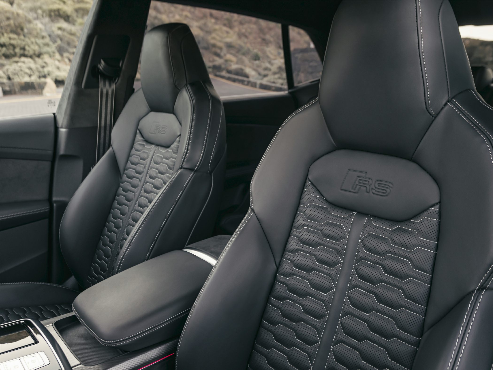 Luxury leather seats with RS emblem and contrast stitching.