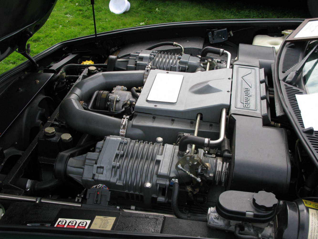 Supercharged V8 engine with distinctive intake and mechanical details