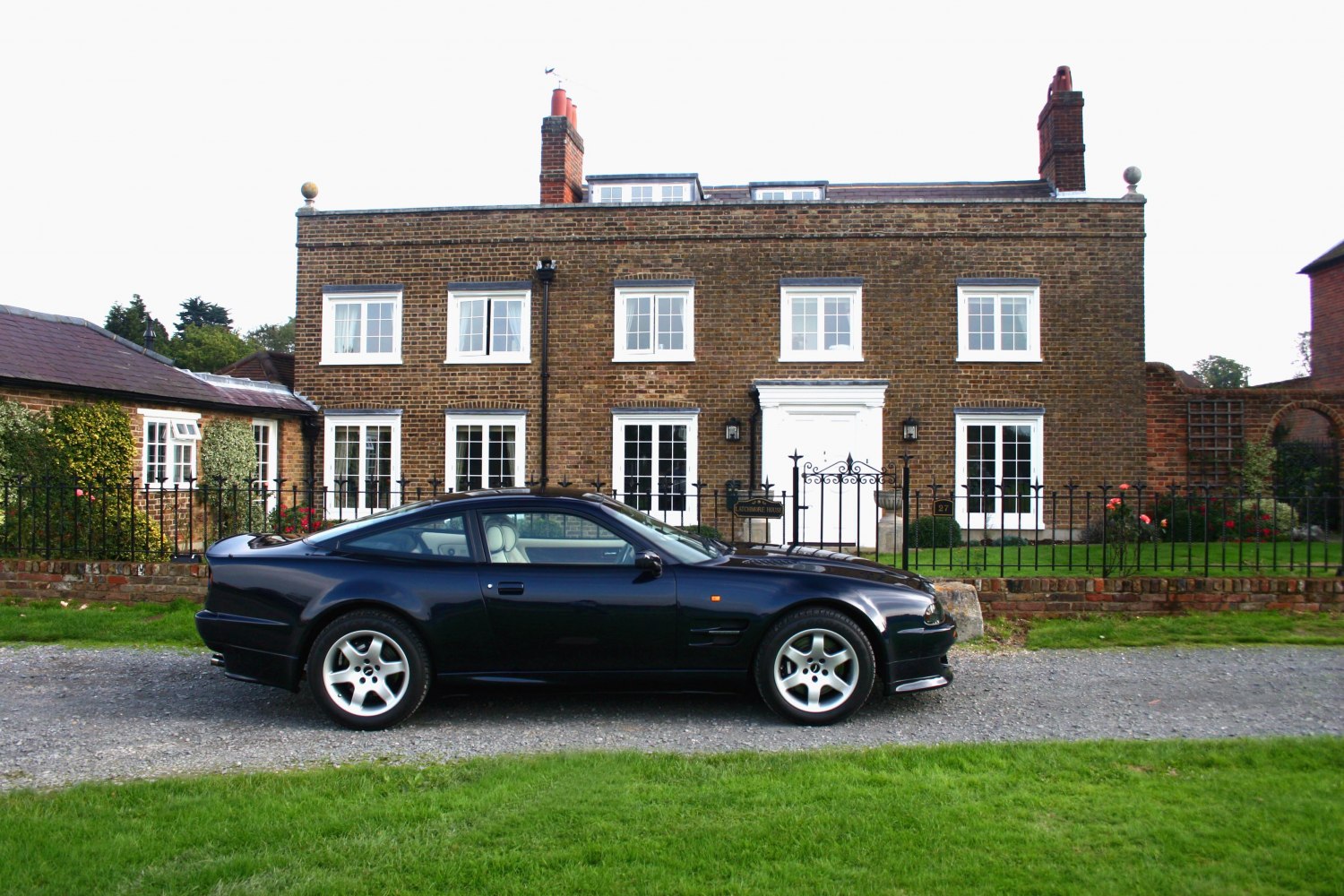 Side view of classic 1990s sports coupe with alloy wheels and smooth body lines