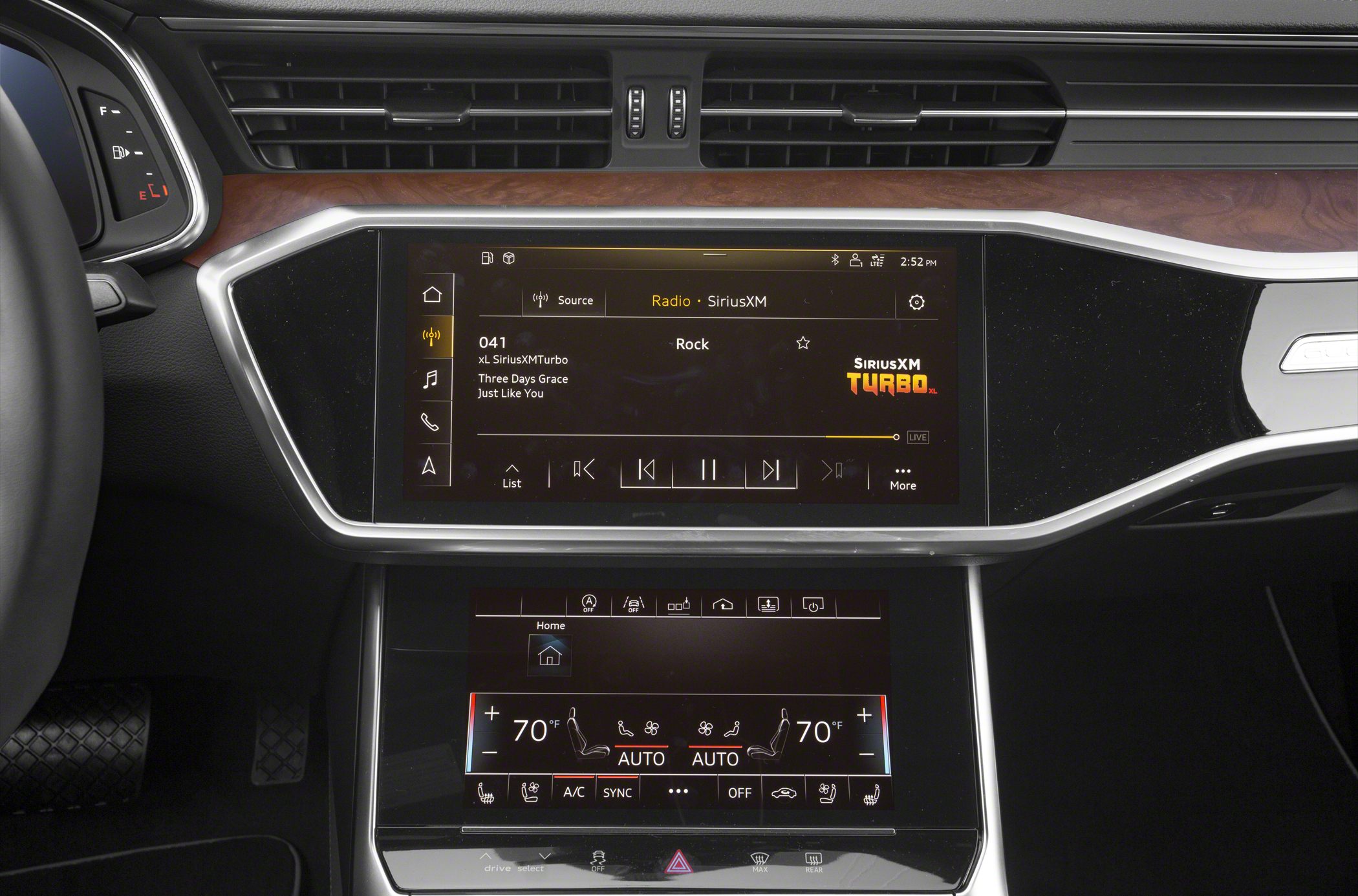 Dual touchscreen infotainment and climate control displays in car interior
