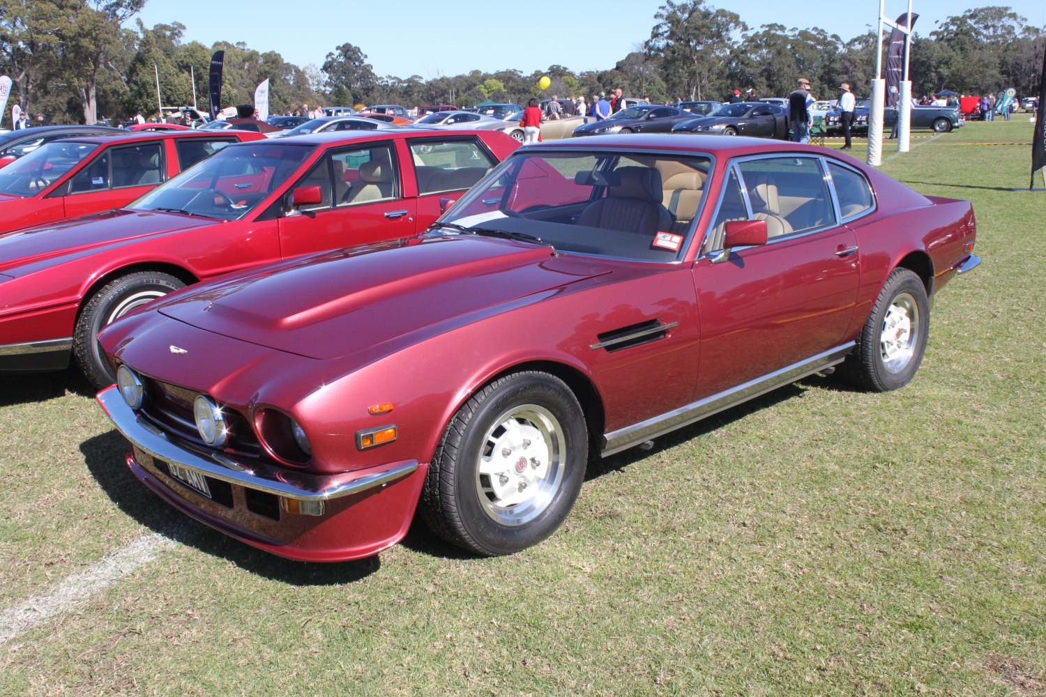 Vintage coupe with round headlights, chrome bumper, and sleek sporty design