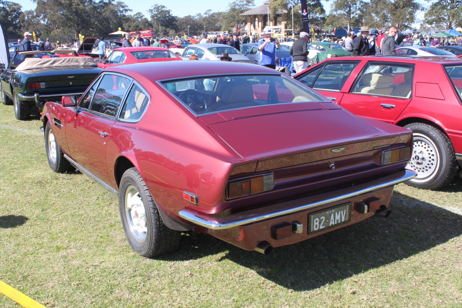 Vintage fastback coupe rear with classic taillights and chrome bumper.
