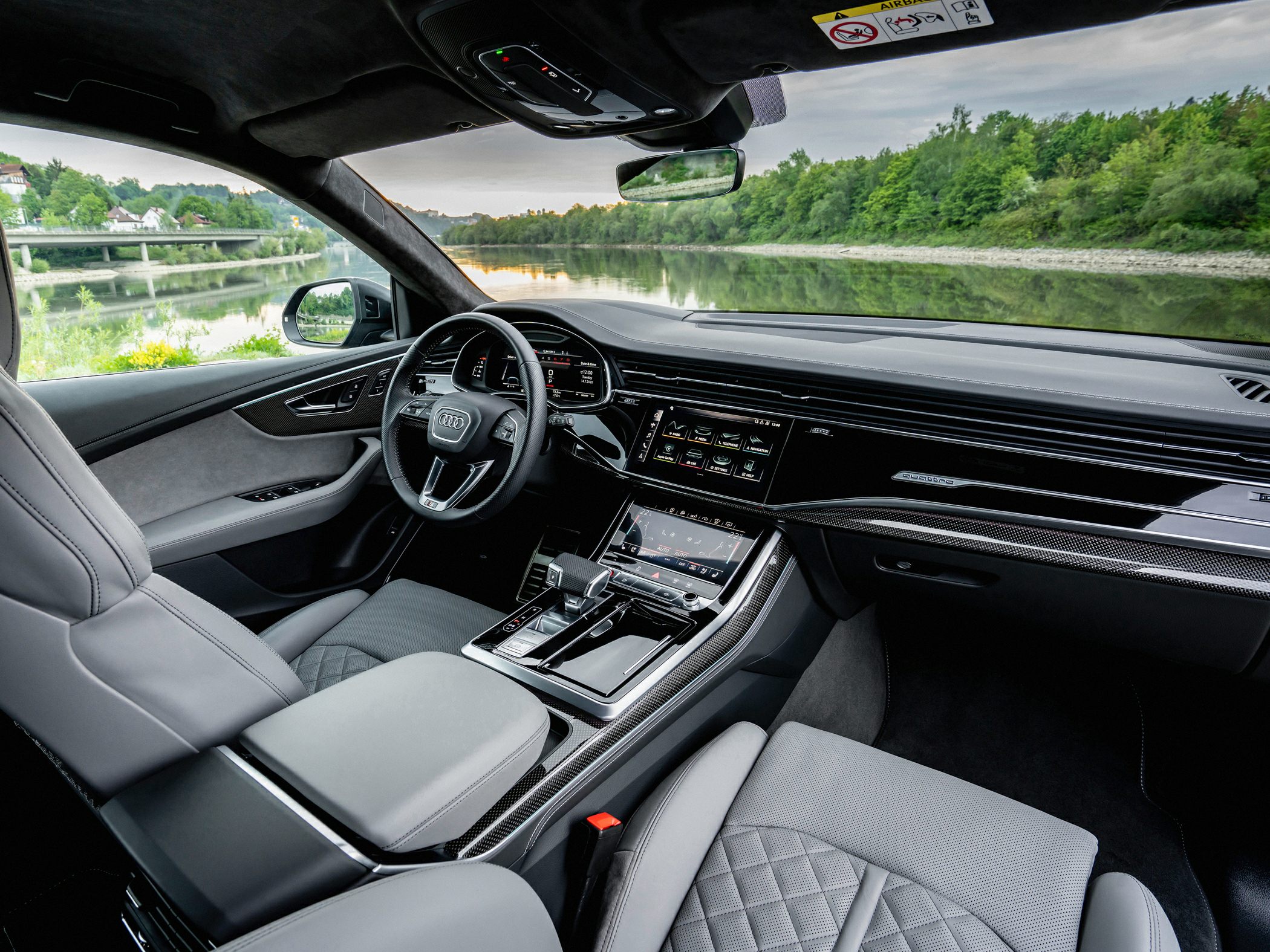 Digital instrument cluster and dual touchscreen infotainment with quilted leather seats