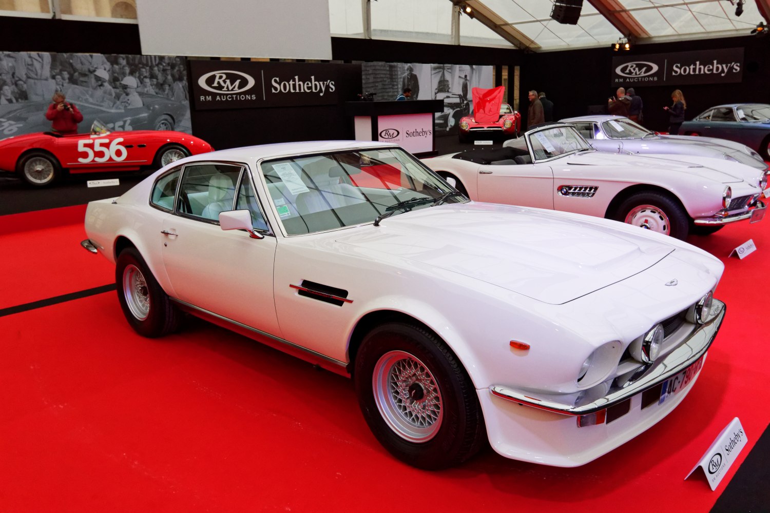 White 1977 coupe with wire-spoke wheels and side air scoop