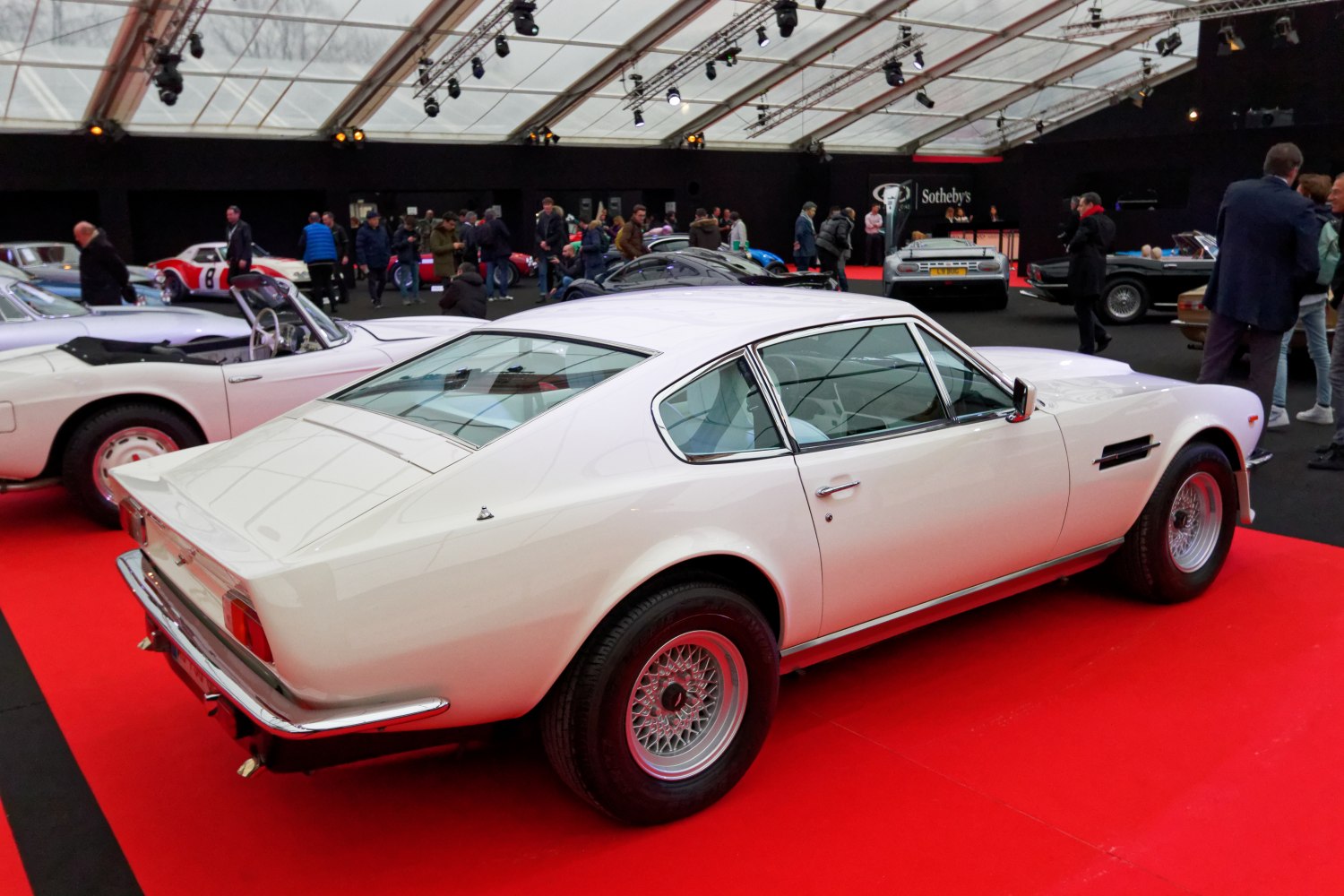 Rear three-quarter view of vintage classic car with wire-spoke wheels