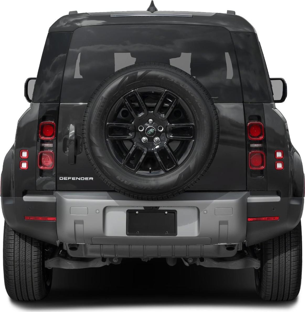 Rear view with spare tire mounted on back door and distinctive taillights
