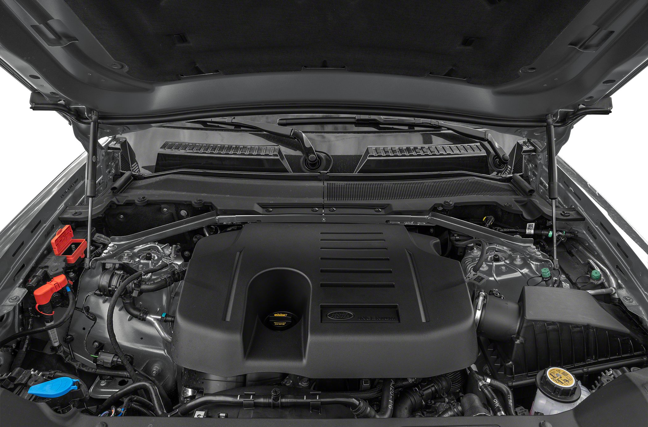 Engine bay with black plastic engine cover and surrounding components