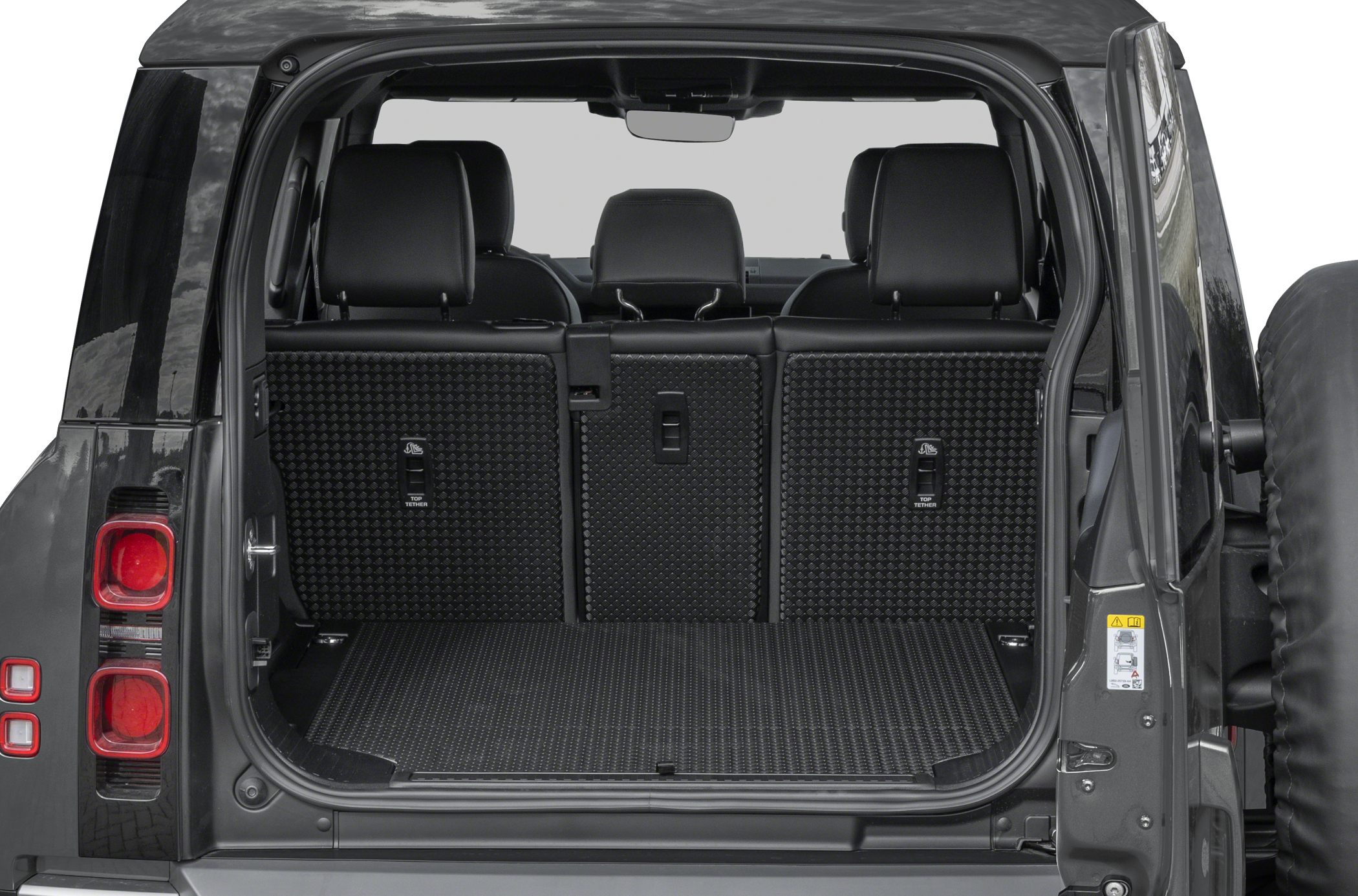 Spacious rear cargo area with foldable seats and rubber mat