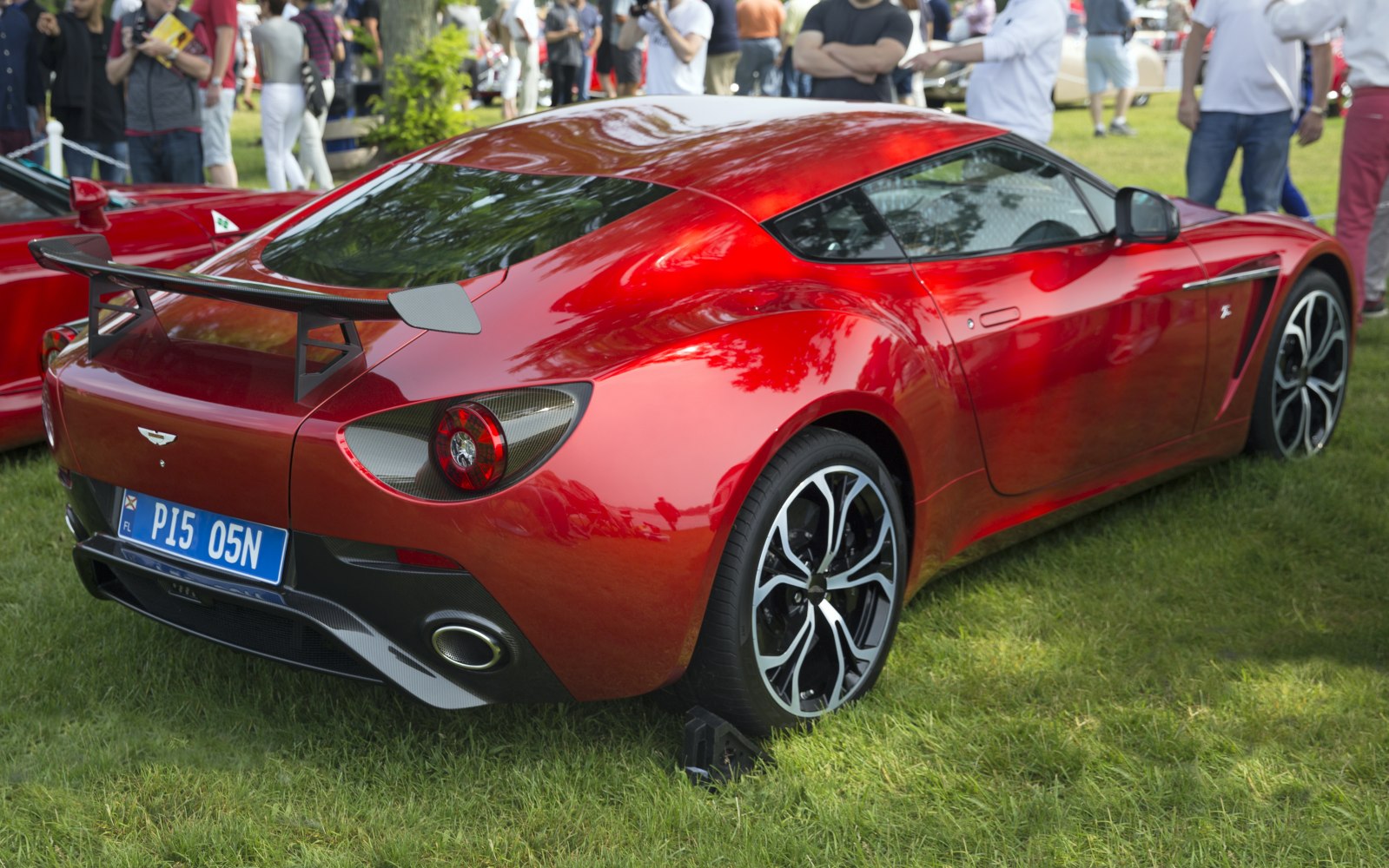 Rear view of sports coupe with carbon fiber rear wing and unique tail lights