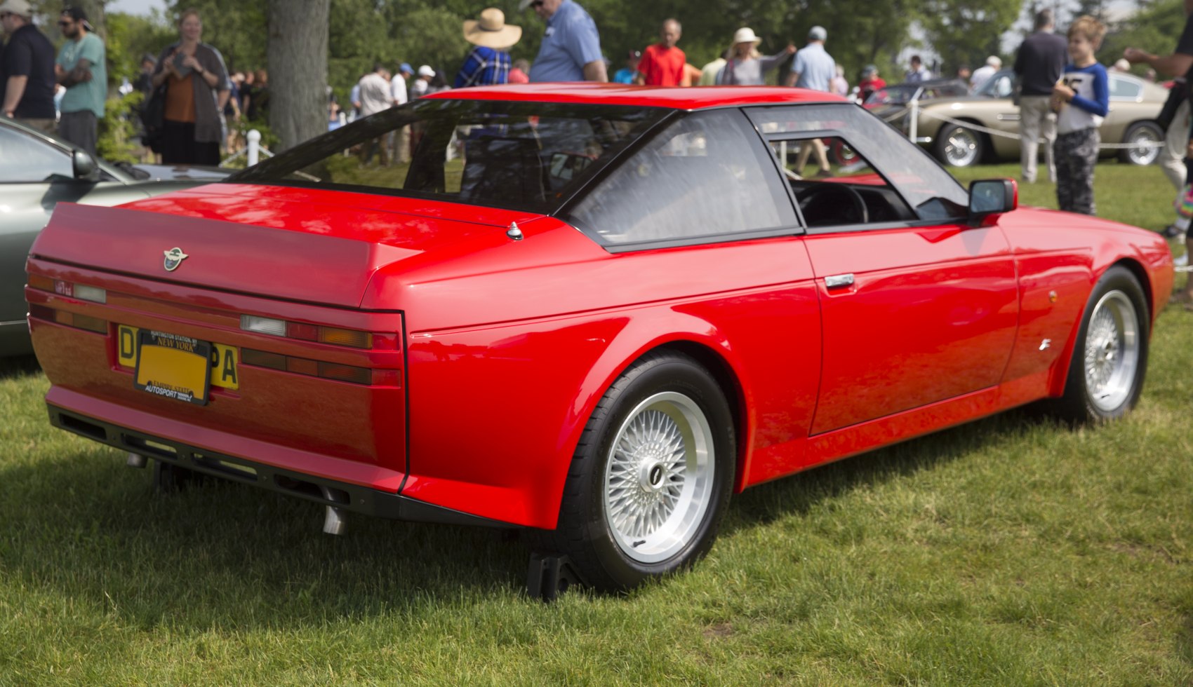 Sharp angular rear design with wire-spoke wheels and distinctive rear lights