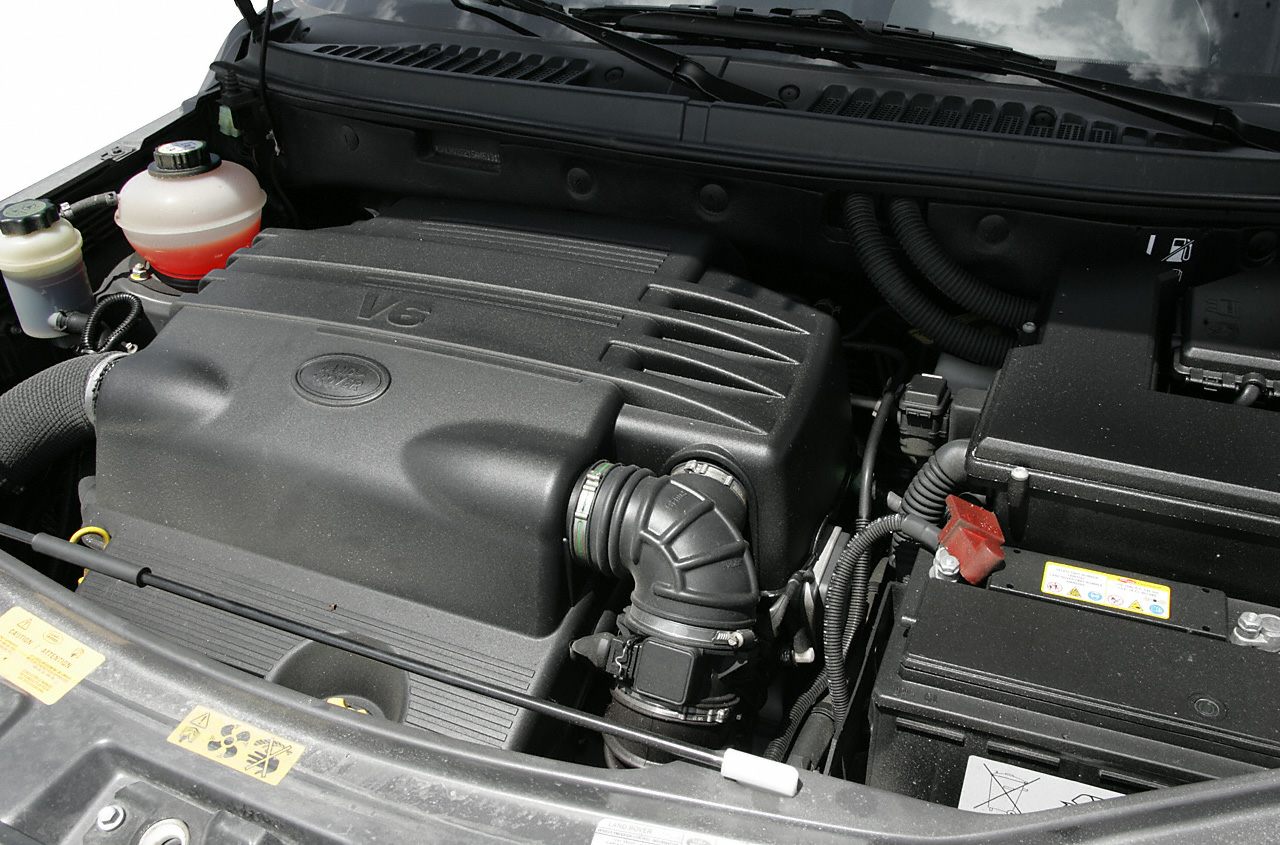 V6 engine with air intake duct and battery in engine bay
