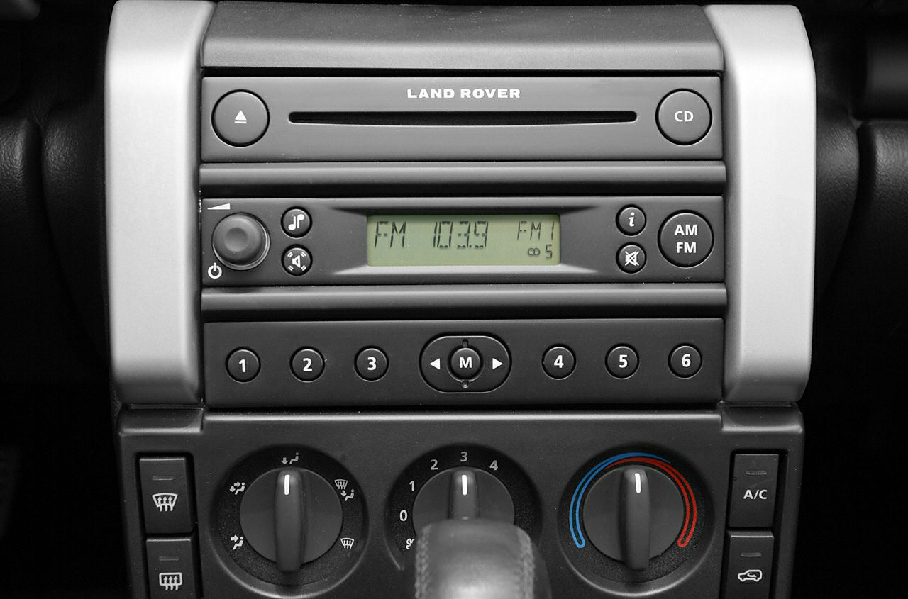 Audio system and climate control panel with knobs and buttons