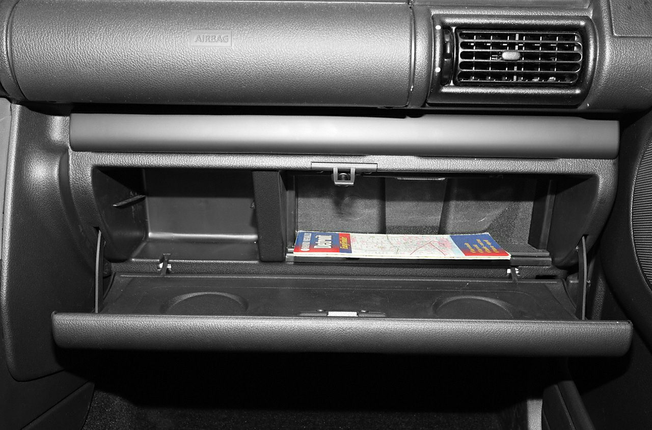 Dashboard glove compartment with storage shelves and cup holders
