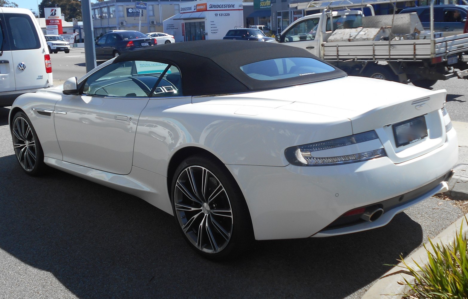 White convertible with soft top and distinct rear design