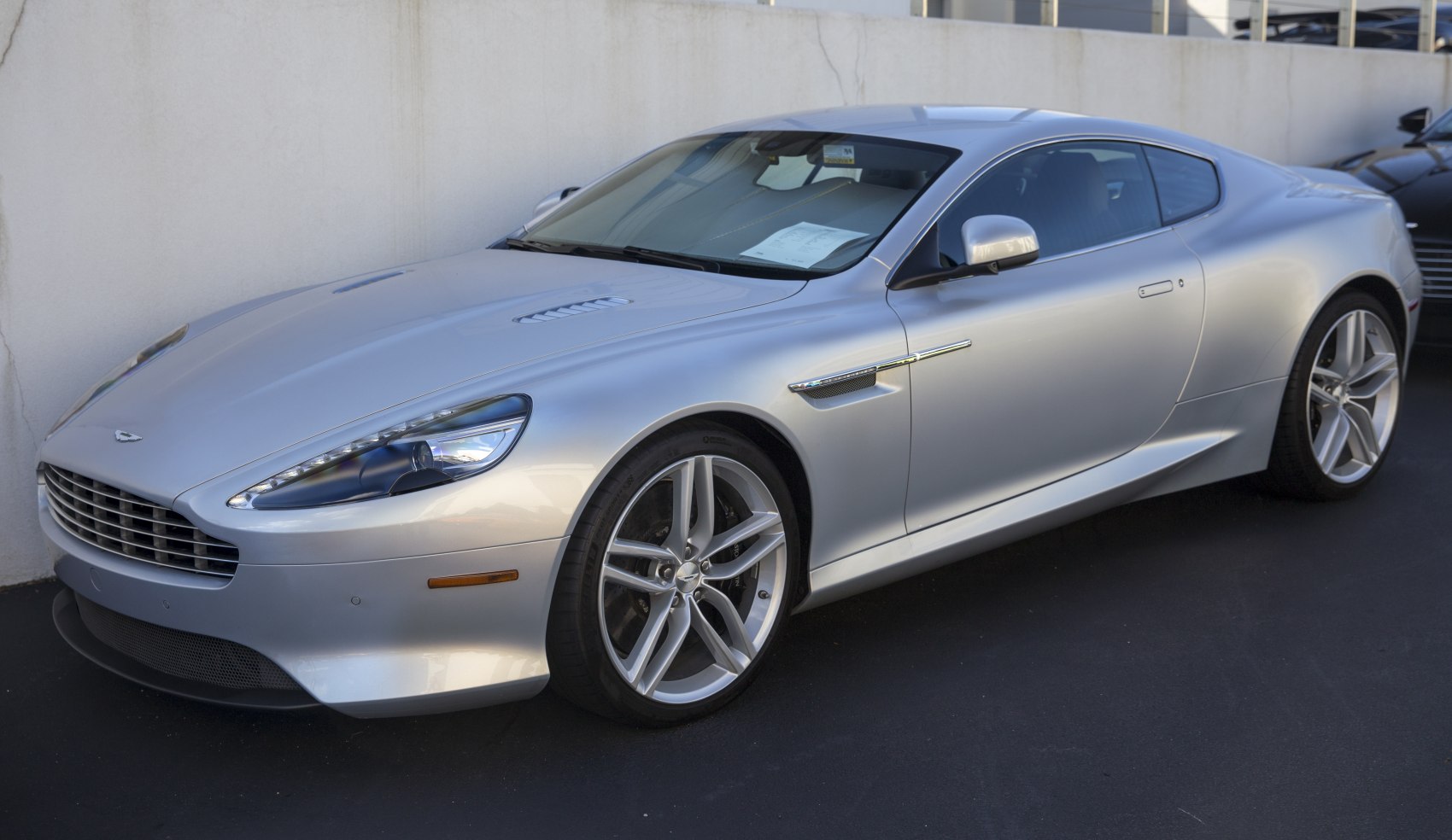 Front and side profile with elegant headlights and alloy wheels