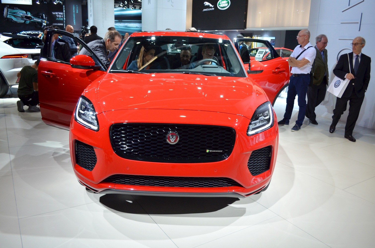 Front view of red SUV with black honeycomb grille and LED headlights