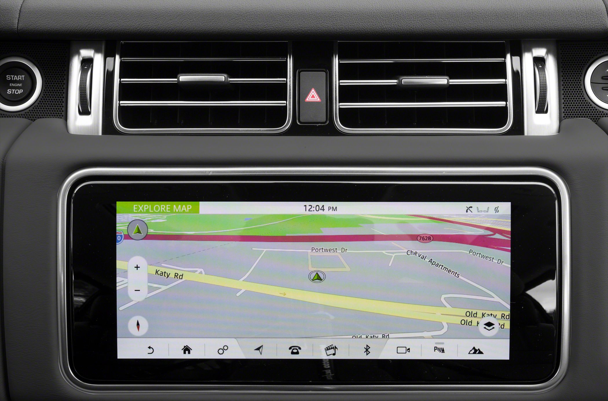 Navigation screen with dashboard air vents and engine start-stop button