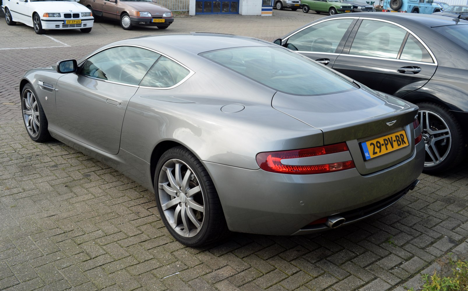 Rear side profile with tail lights and alloy wheels
