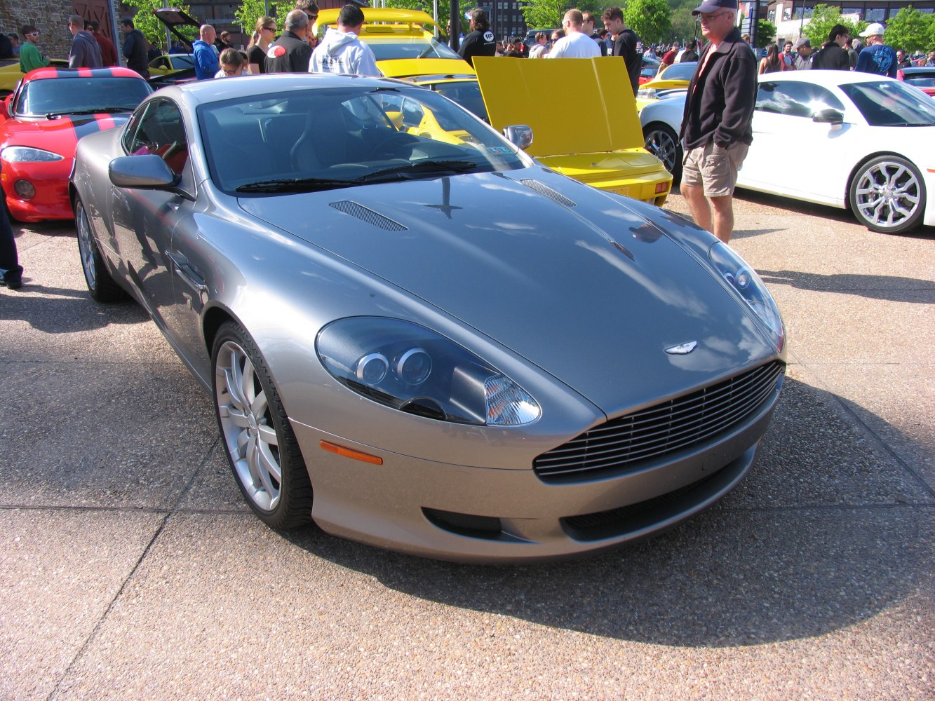 Silver coupe front with hood vents and sleek headlights