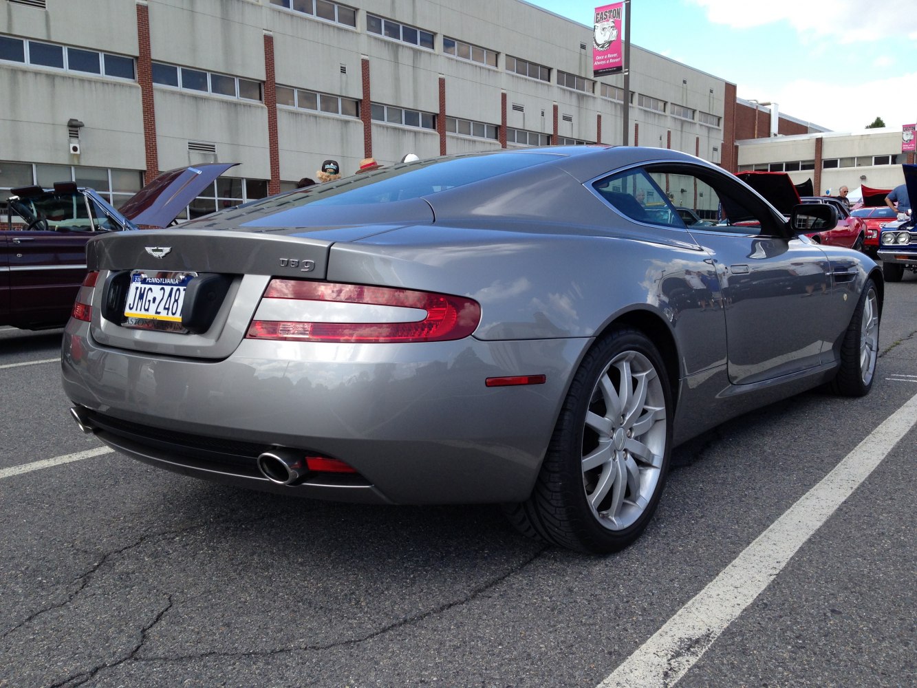 Rear view of sleek coupe design with distinctive taillights and dual exhausts