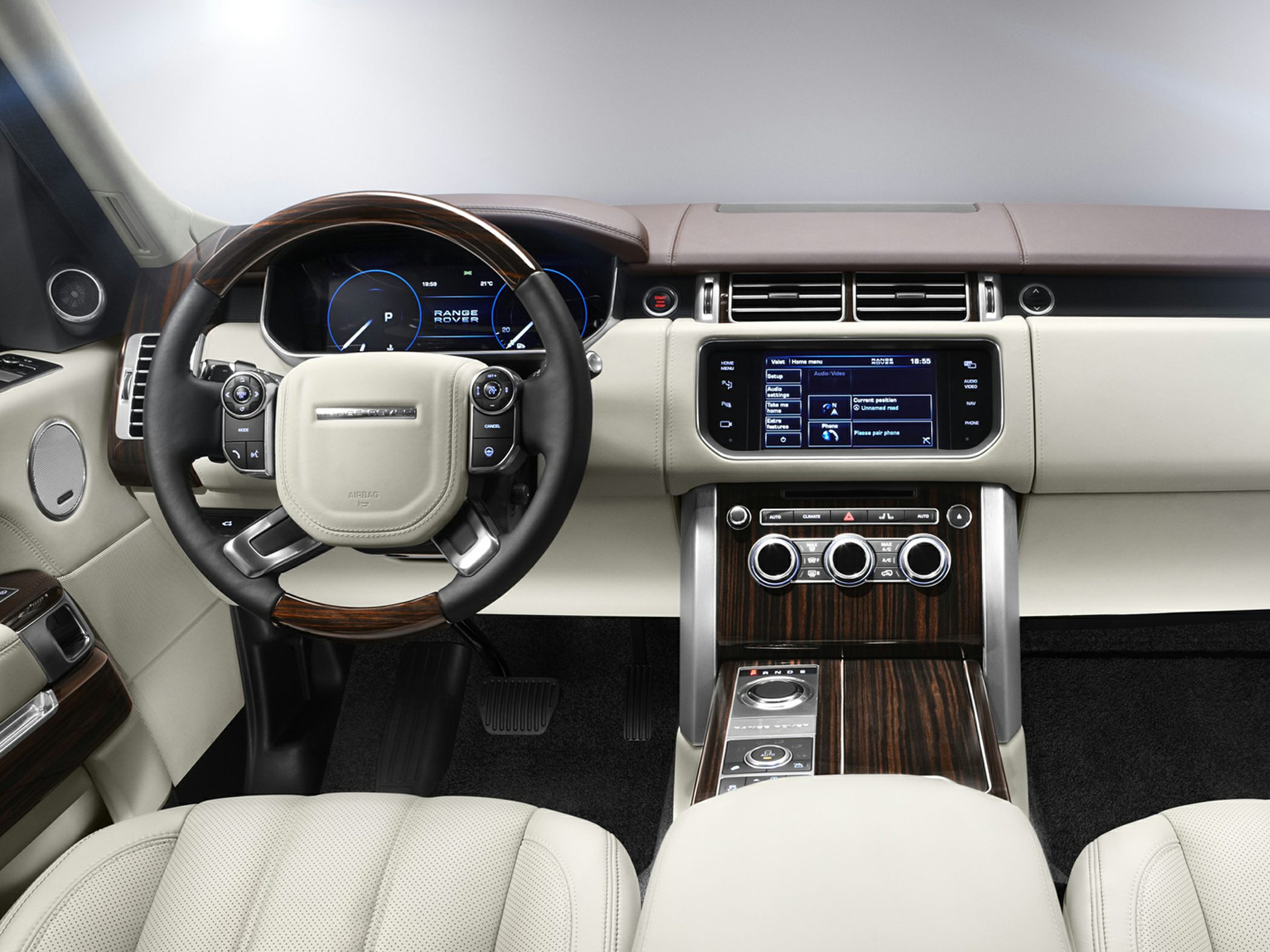 Luxury steering wheel and dashboard with touchscreen and wood trim