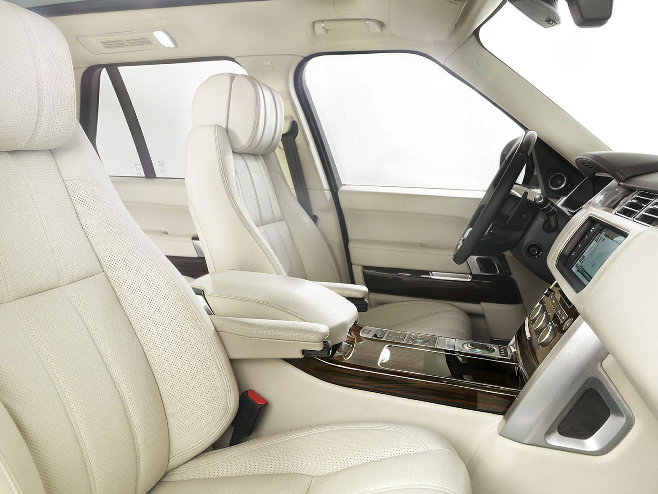 Beige perforated leather seats and wood finish center console