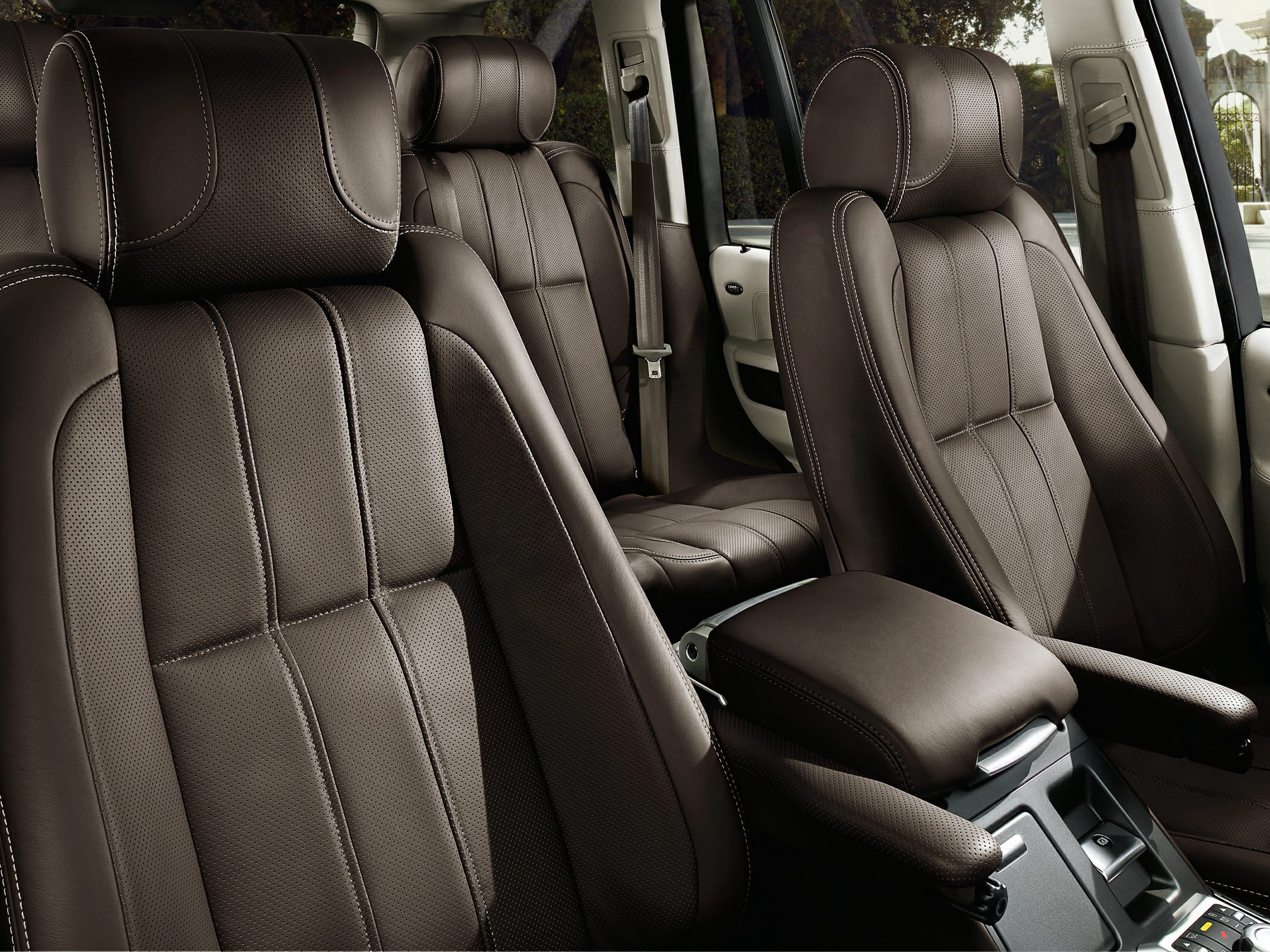 Perforated leather seats and armrest in a luxury SUV interior