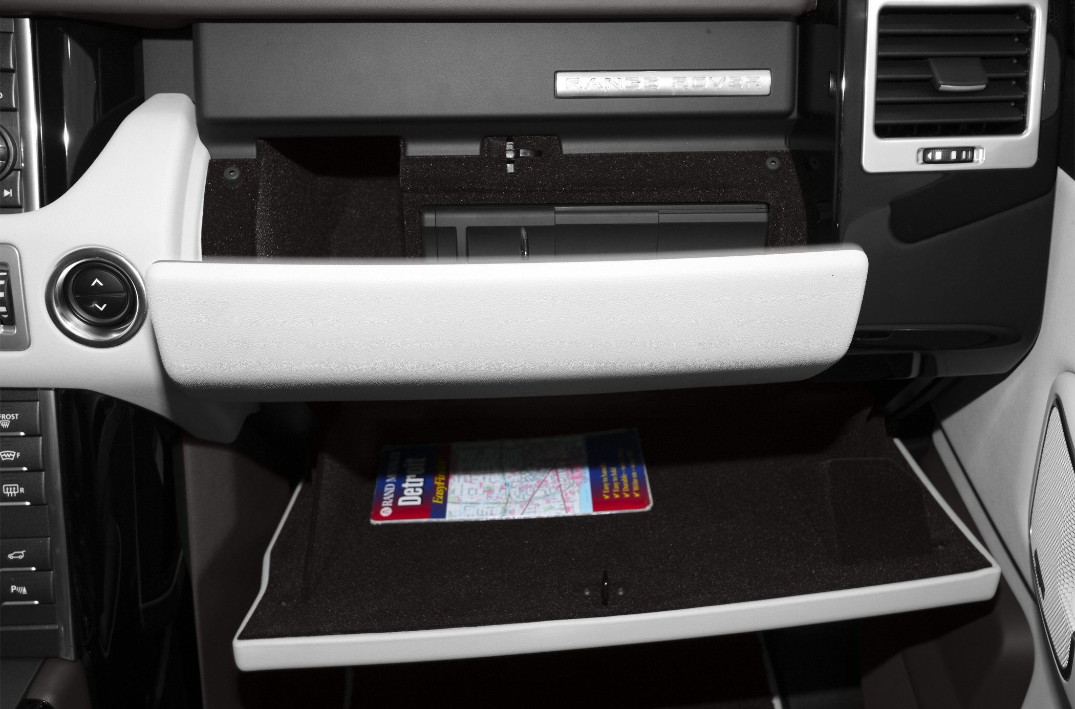 Glovebox compartment and interior storage door of a luxury SUV