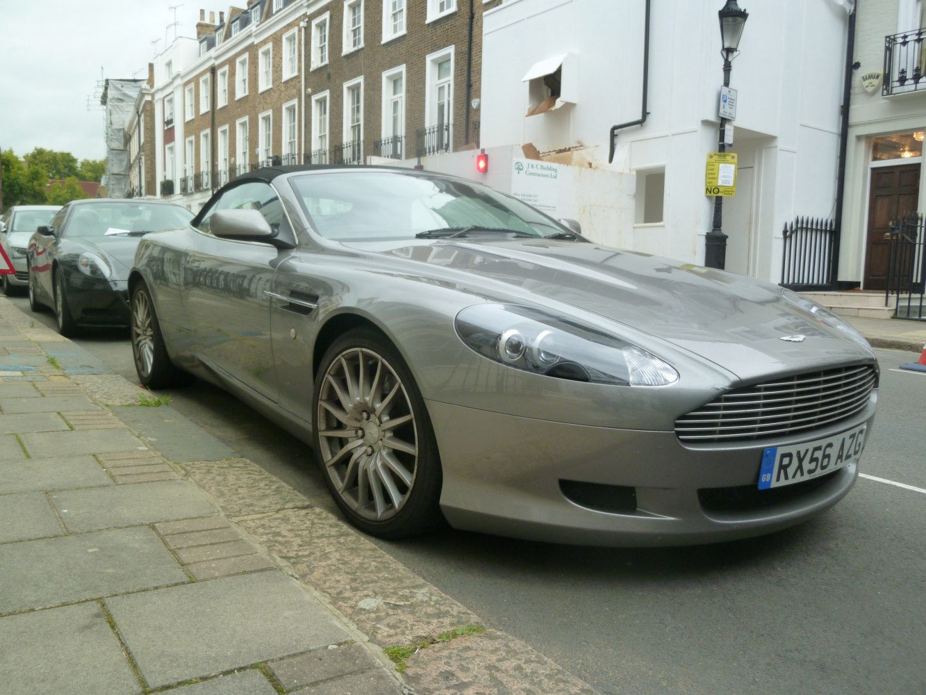 Silver convertible with sleek alloy wheels and black soft top