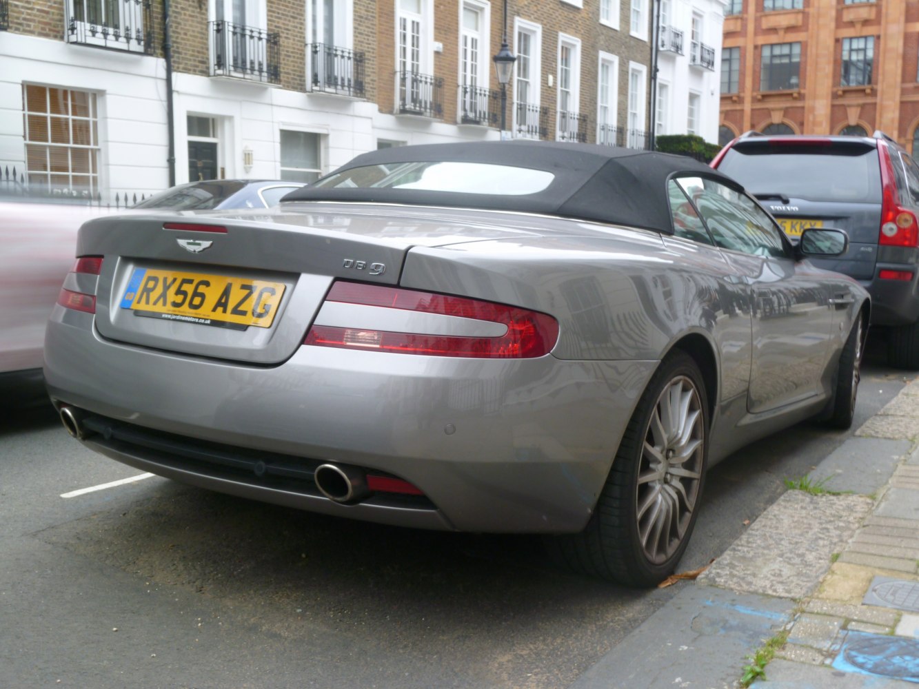 Rear view of convertible with soft-top and dual exhausts