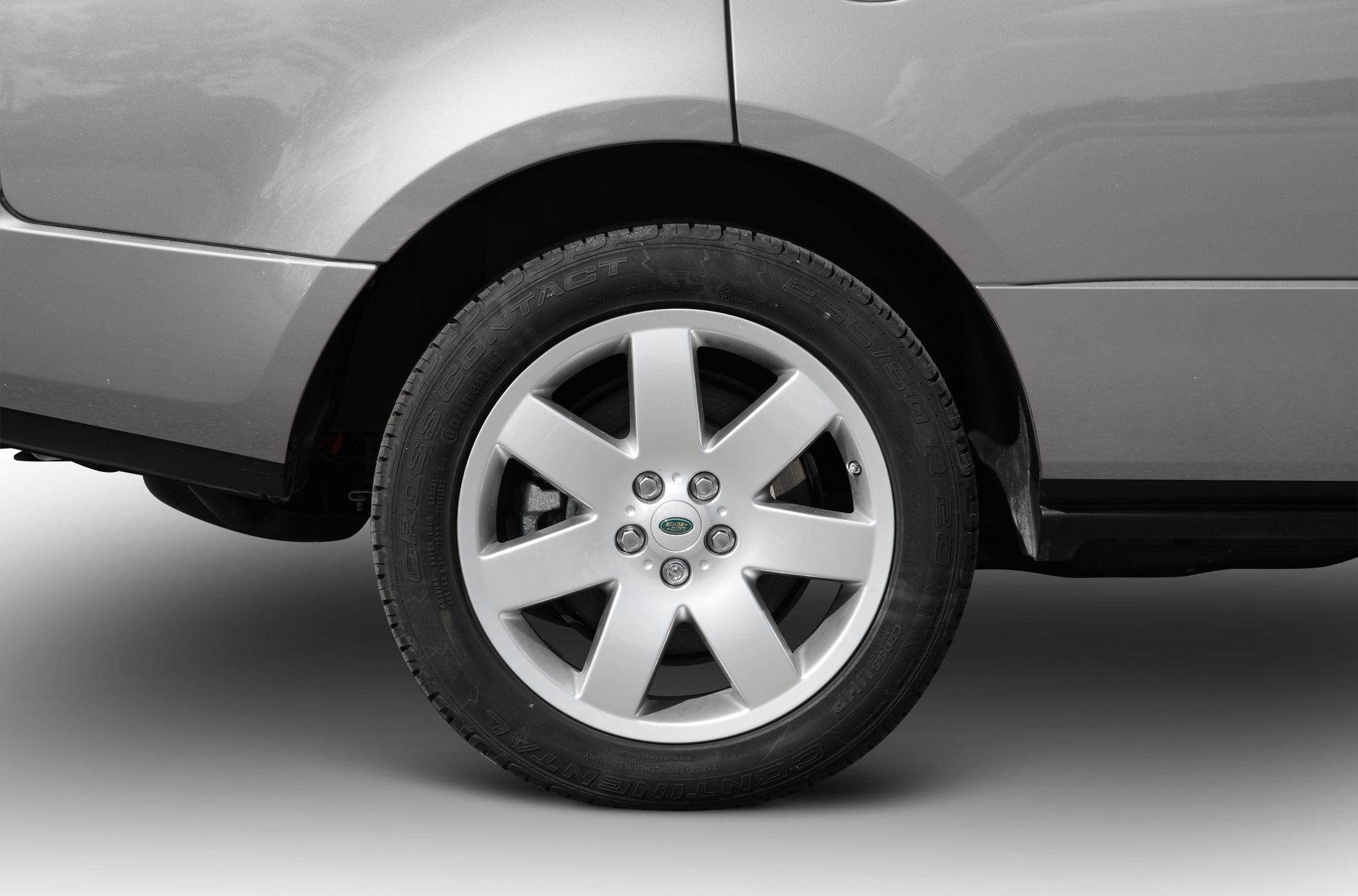 Close-up of alloy wheel and tire with Continental CrossContact branding.