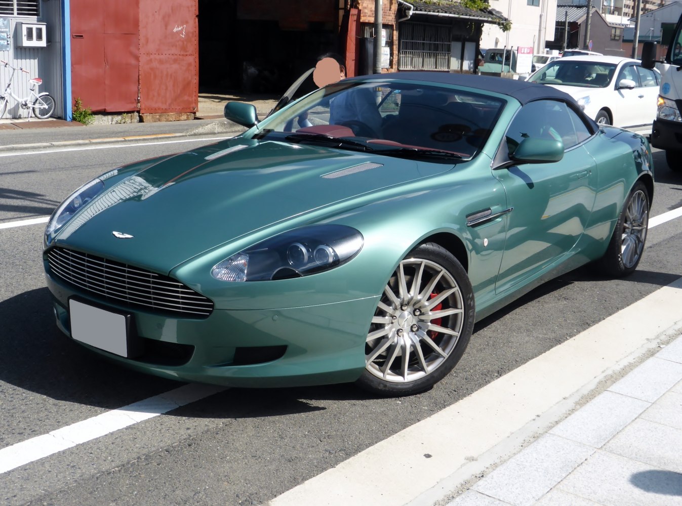 Convertible sports car with alloy wheels and soft-top roof