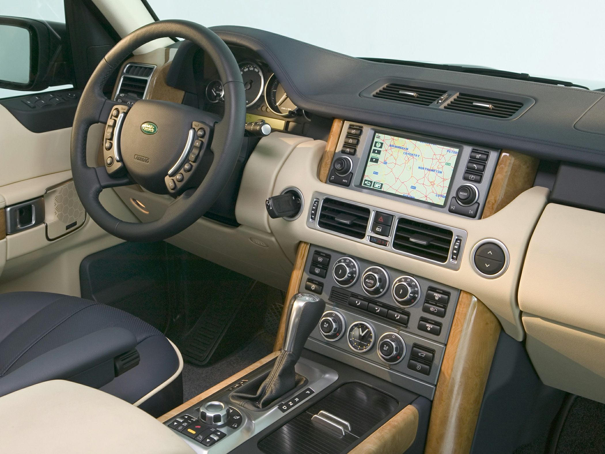 Leather steering wheel, built-in navigation system, climate control dials