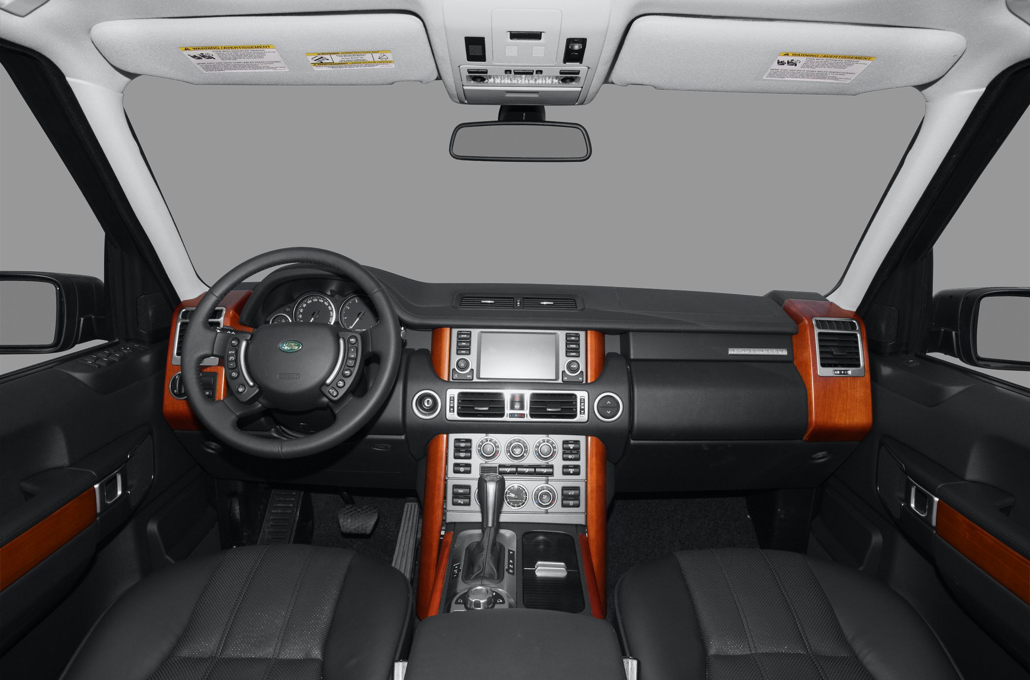 Luxury SUV interior featuring wood trim and a modern dashboard layout